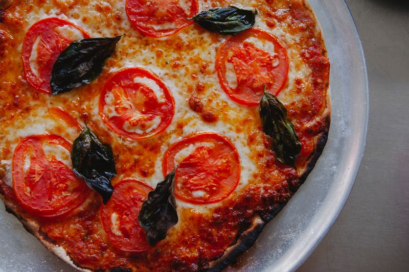 Green lantern pizza family bundle with two large pizzas and sides
