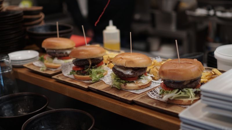 Green lantern grill burger with fresh toppings special offer