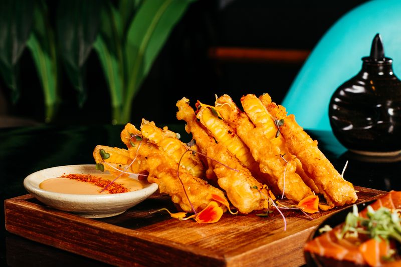 Golden fried mozzarella sticks with marinara sauce